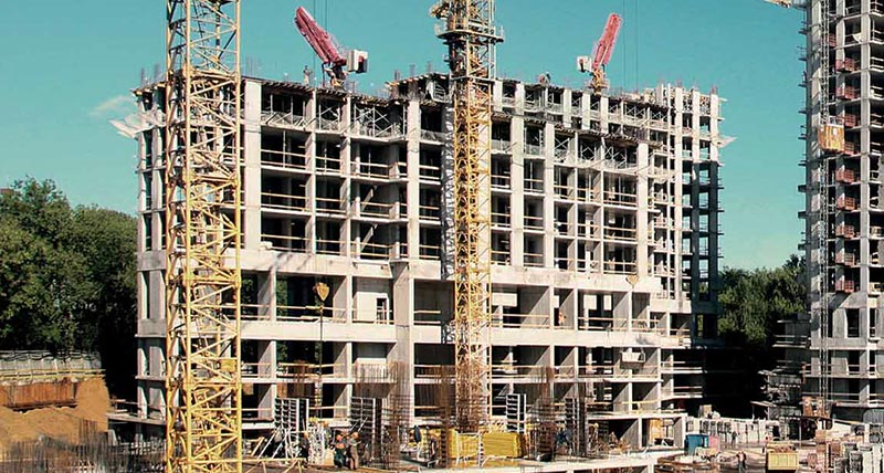 Building construction site with a high rise building being constructed